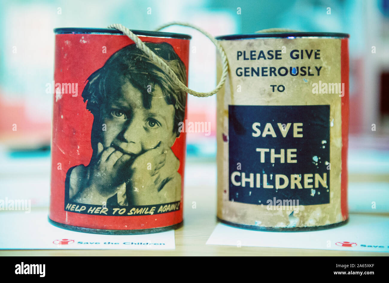 Save the Children vintage collecting charity cans Stock Photo
