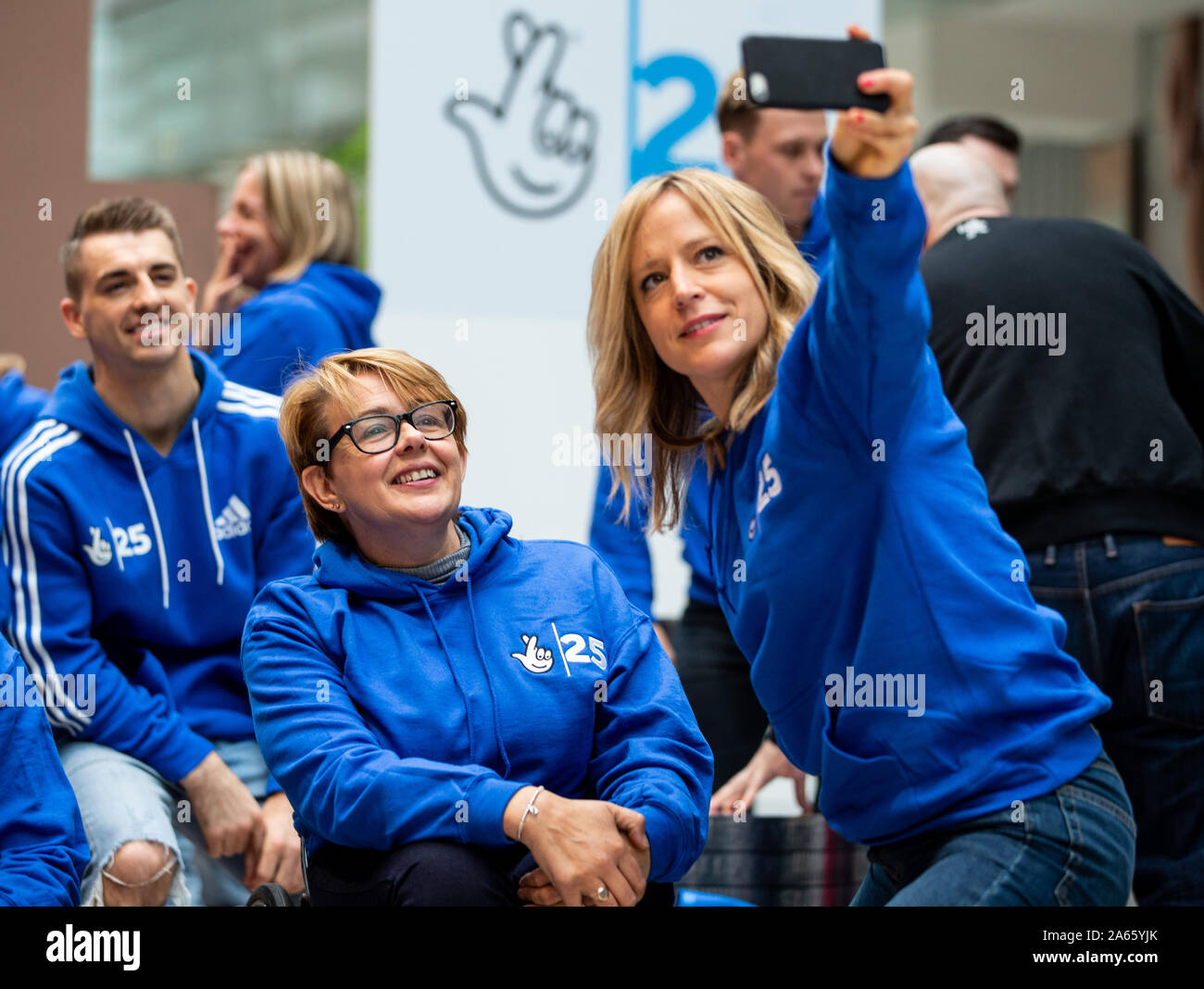 Baroness Tanni Grey Thompson and Jenny Jones pose for a selfie before a photocall celebrating inspirational Olympic and Paralympic medallists from the past two decades gathered together celebrate The National Lottery's 25thÊBirthday and its transformative effect onÊGreat Britain and Northern Ireland'sÊmedal successÊsinceÊ1997, in which 864 medals have been won, when funding was first awarded to eliteÊathletes at Westfield Stratford City, London. Stock Photo