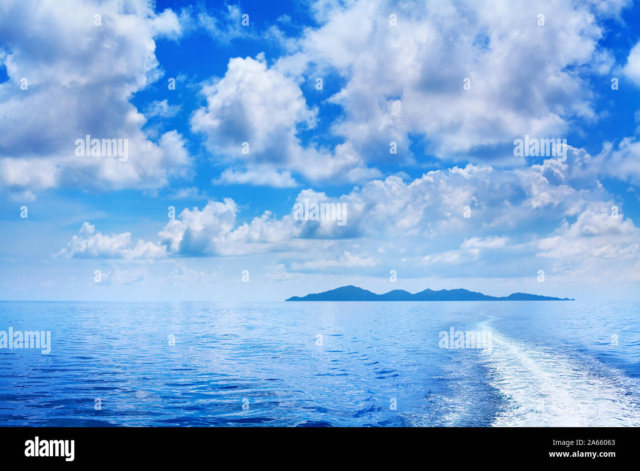 White Cumulus Clouds In Blue Sky Over Sea Landscape Many Clouds Above Ocean Water Panorama Ship Trail Island On Horizon Line Tropical Seascape Stock Photo Alamy White Cumulus Clouds In Blue Sky Over Sea Landscape Many Clouds Above Ocean Water Panorama Ship Trail Island On Horizon Line Tropical Seascape Stock Photo Alamy