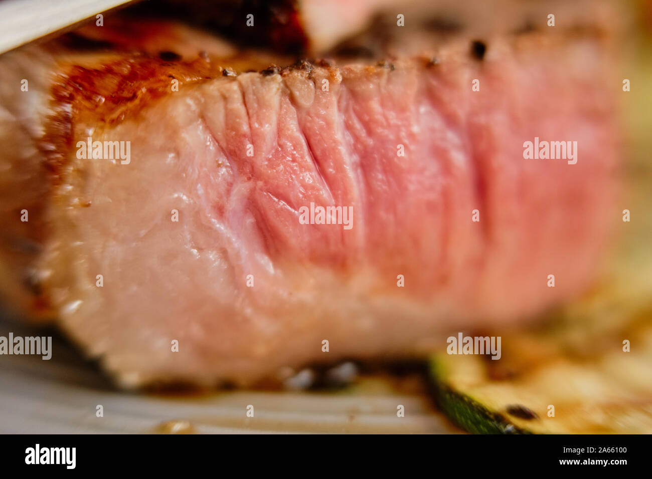 Macro photo with shallow depth of field of section of beef steak medium rare Stock Photo