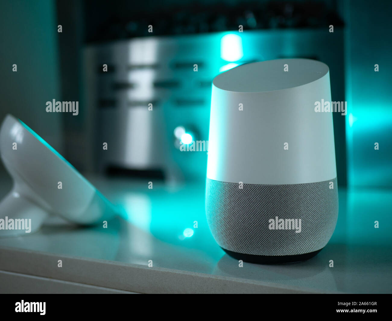 Smart home speaker device lit with colour changing LED lamp light ...