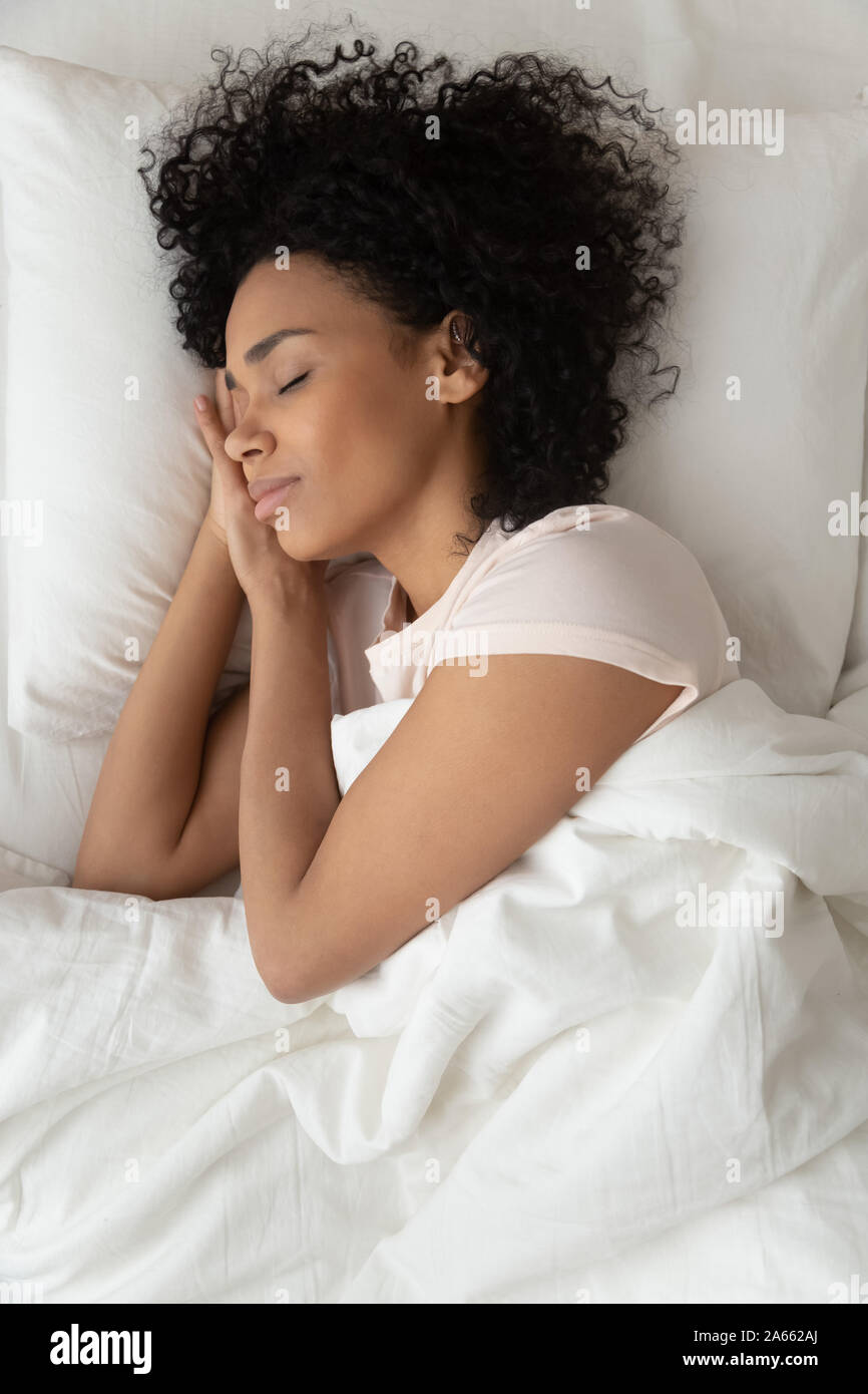 Black girl sleeping in bed hi-res stock photography and images - Alamy