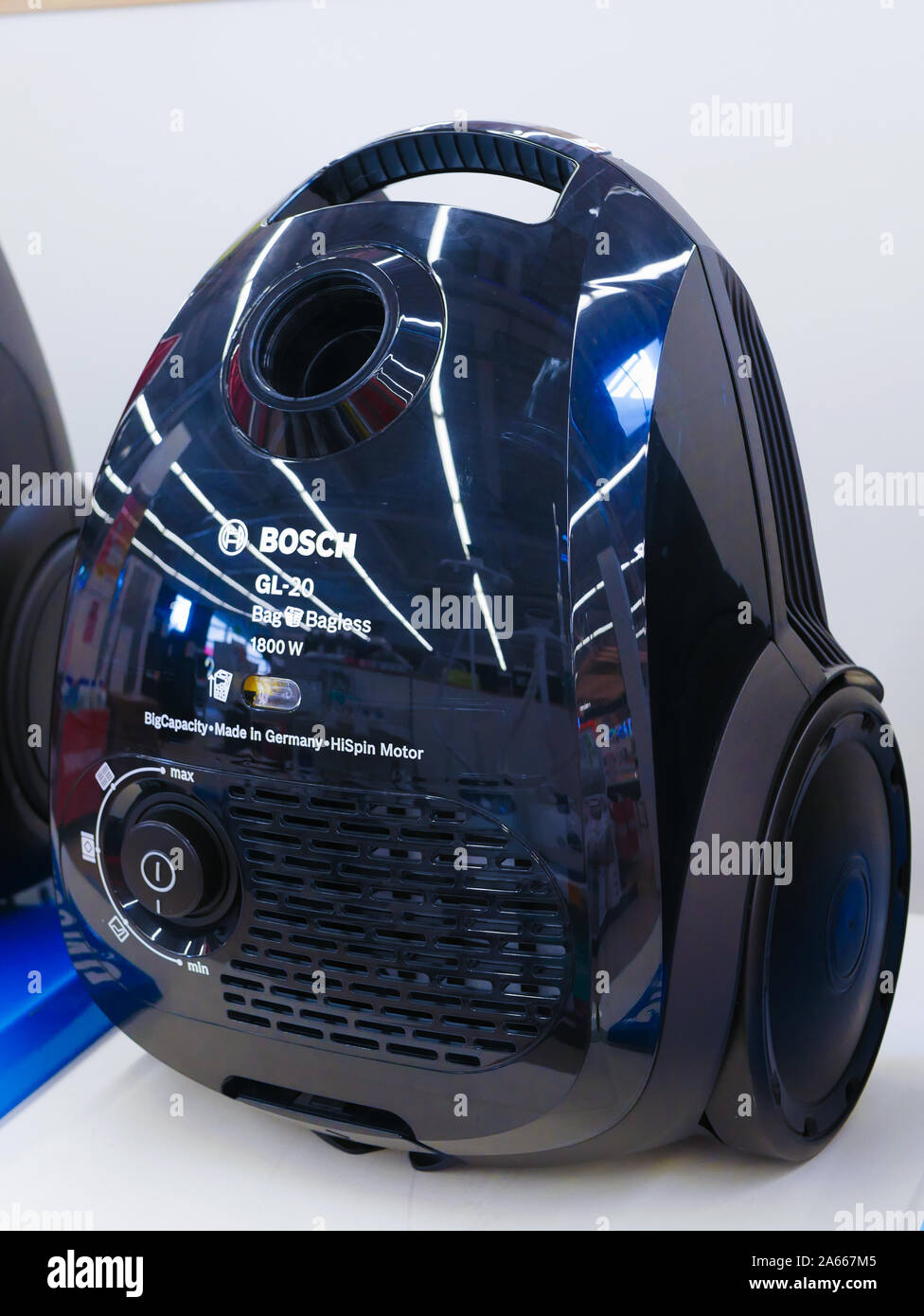 MOSCOW, RUSSIA - April 24, 2019: blue vacuum cleaner. at the store counter. stand on a shelf of a store. Stock Photo