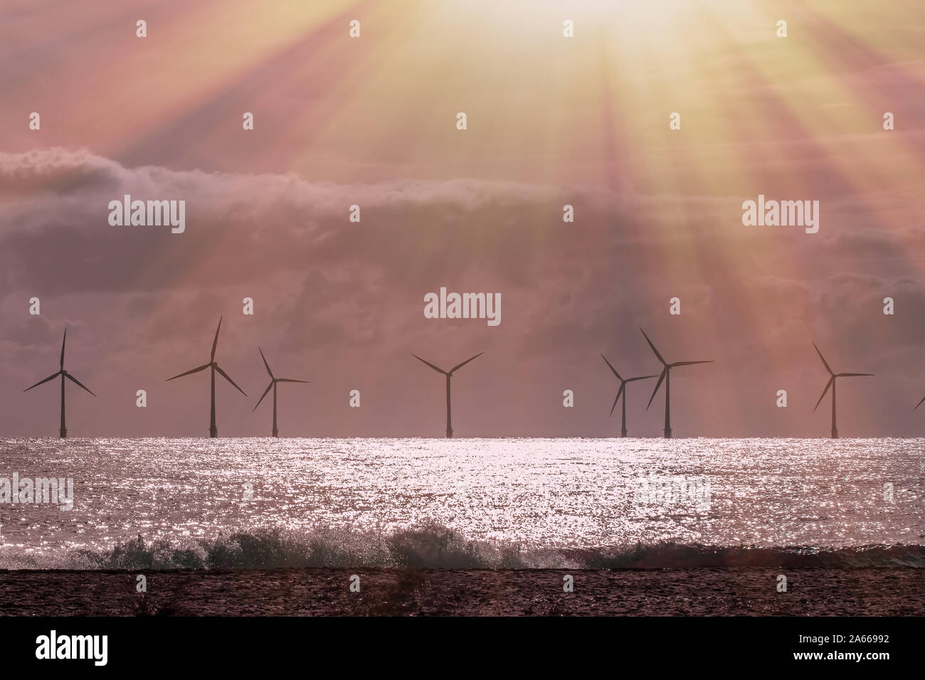 Solar wind and wave power. Beautiful alternative energy landscape scene. Sustainable resources calm and spiritual background image with offshore windf Stock Photo