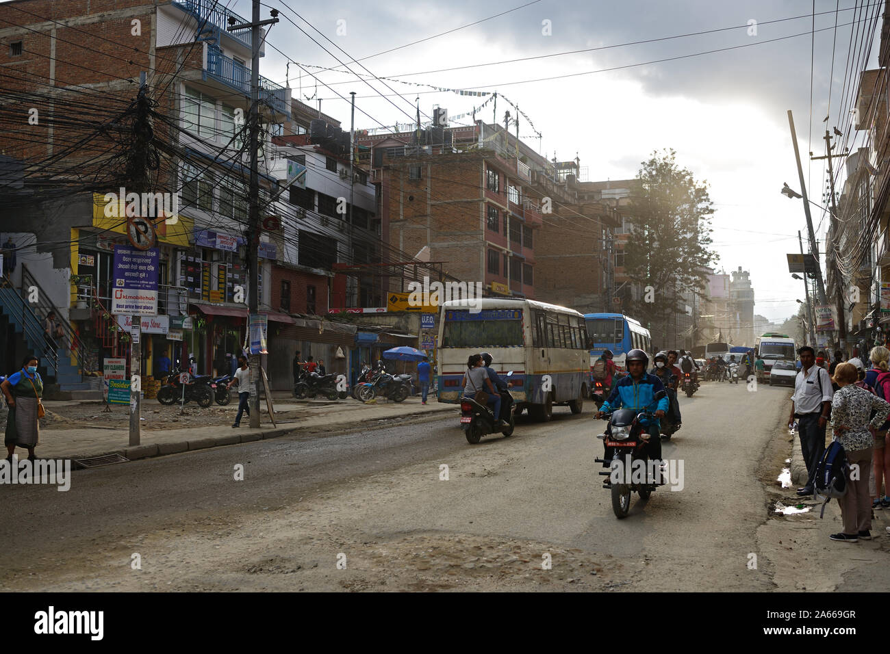 Boudha Road is a busy, badly maintained road in the centre of Kathmandu, Nepal. It is often dusty in dry weather and flooded in wet weather. Stock Photo