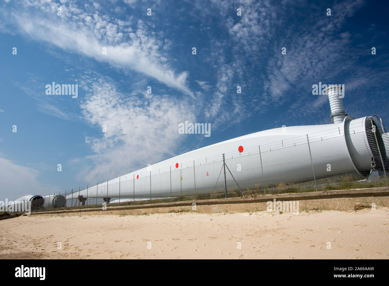 Wind turbine blade parts. Renewable energy investment. Power industry development. Massive blades stored at Great Yarmouth outer harbour UK ready for Stock Photo