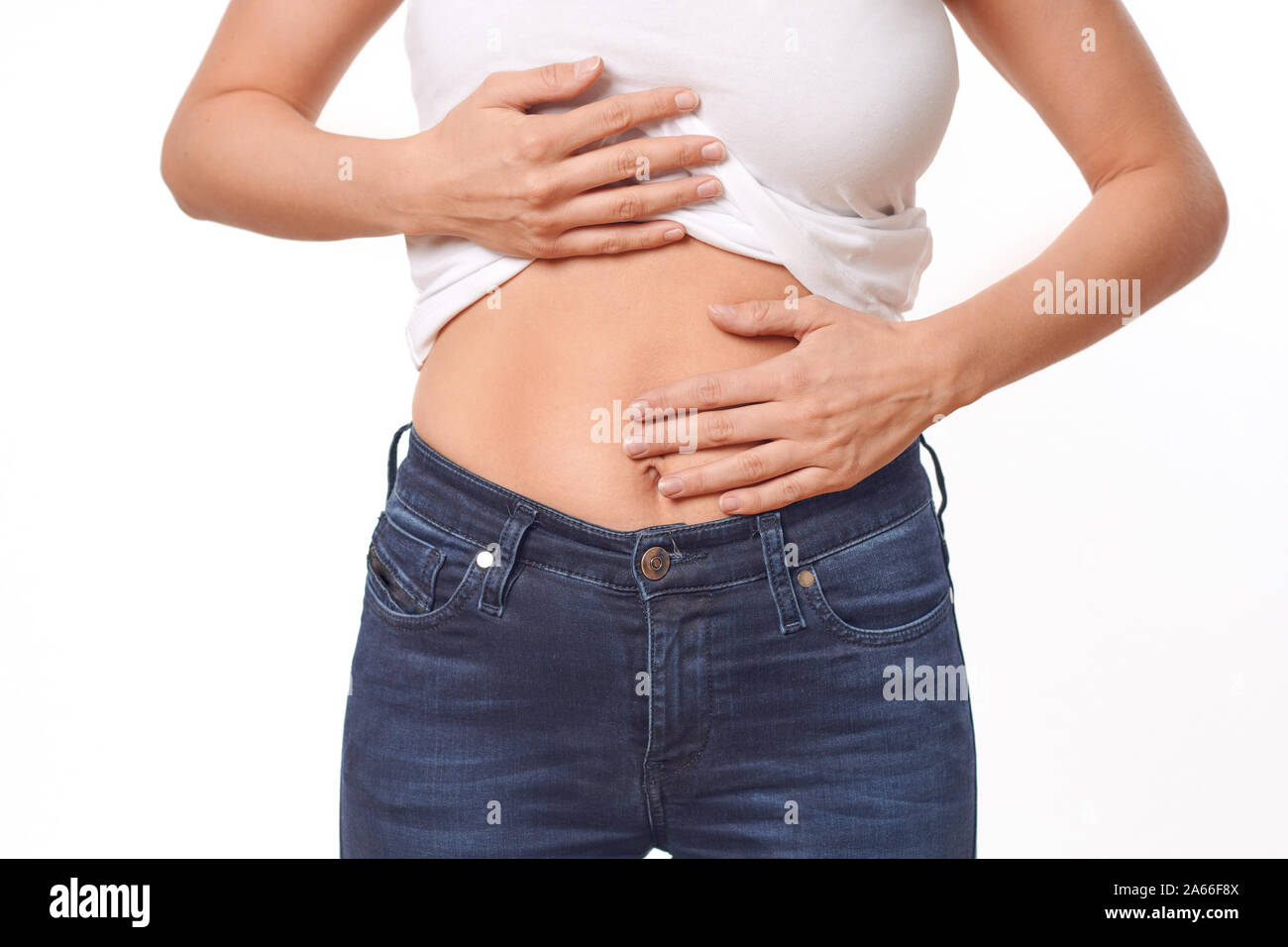 Woman with her monthly menstrual pains clutching her stomach with her