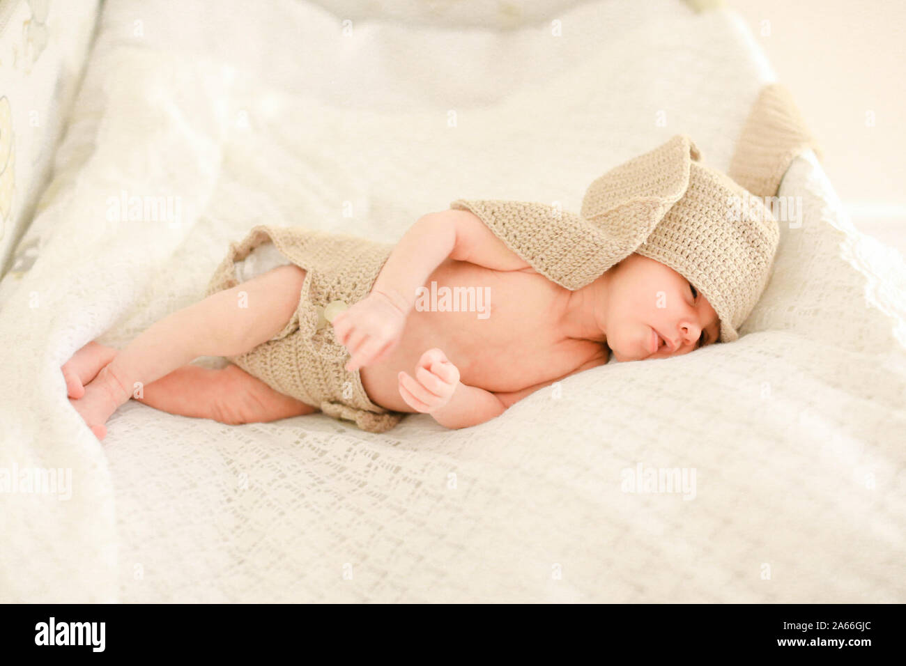 Cute newborn baby sleeping and wearing crocheted clothes Stock Photo ...