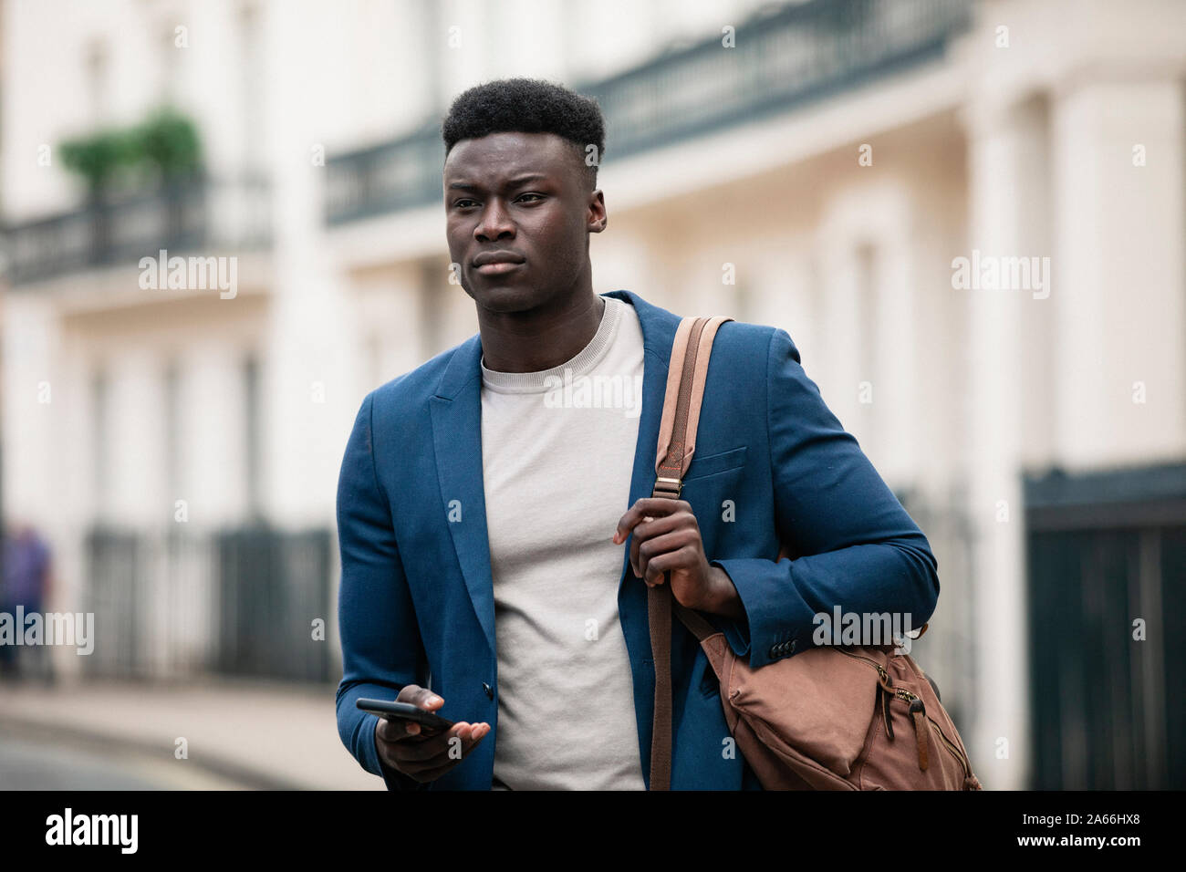 Businessman with shoulder bag walking hi-res stock photography and images -  Alamy