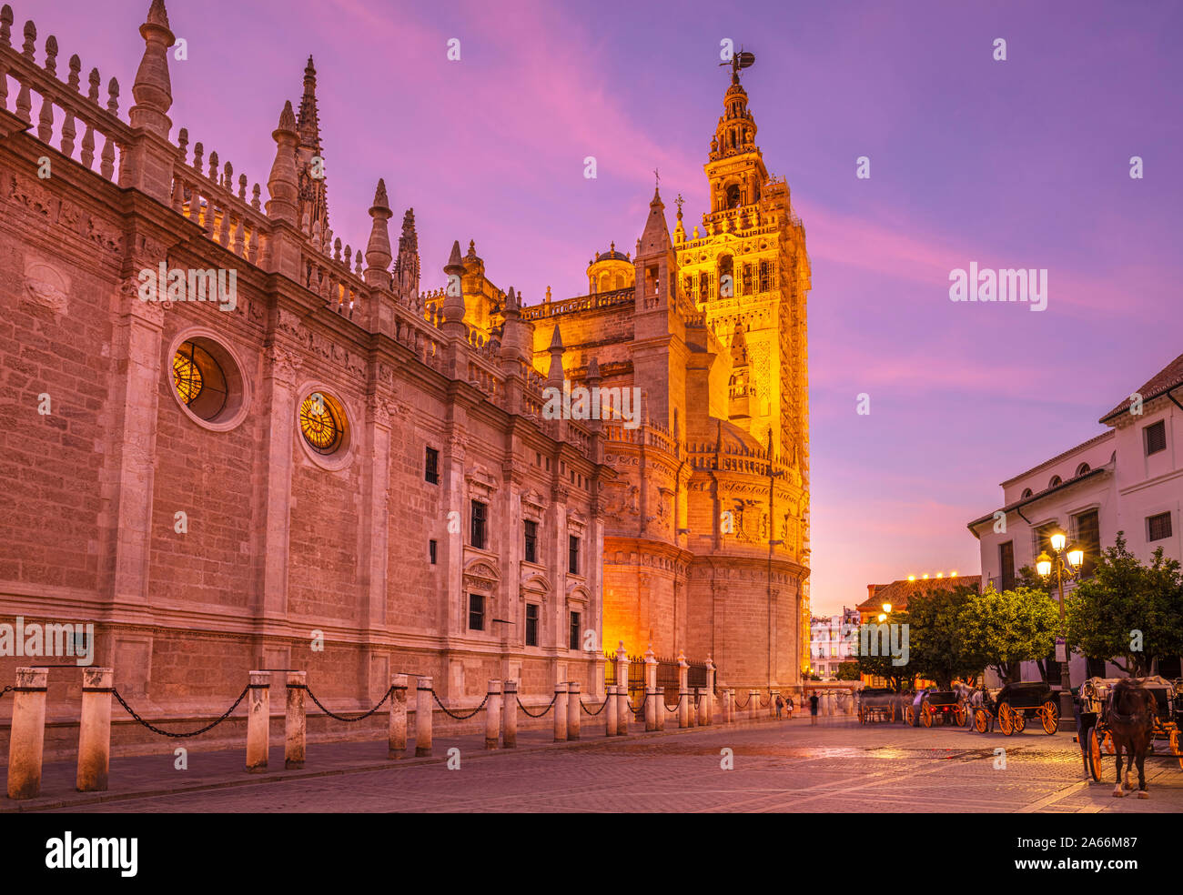 Seville sunset Sevilla Seville Spain Seville cathedral Seville and the Seville General Archive of the Indies building at night Seville Spain EU Europe Stock Photo