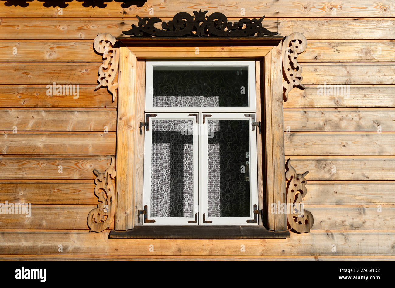 Window of a house of a Russian Old Believer fisherman. This house of Pechonkin, the name of its owner, was probably built in 1863 in the town of Kalla Stock Photo