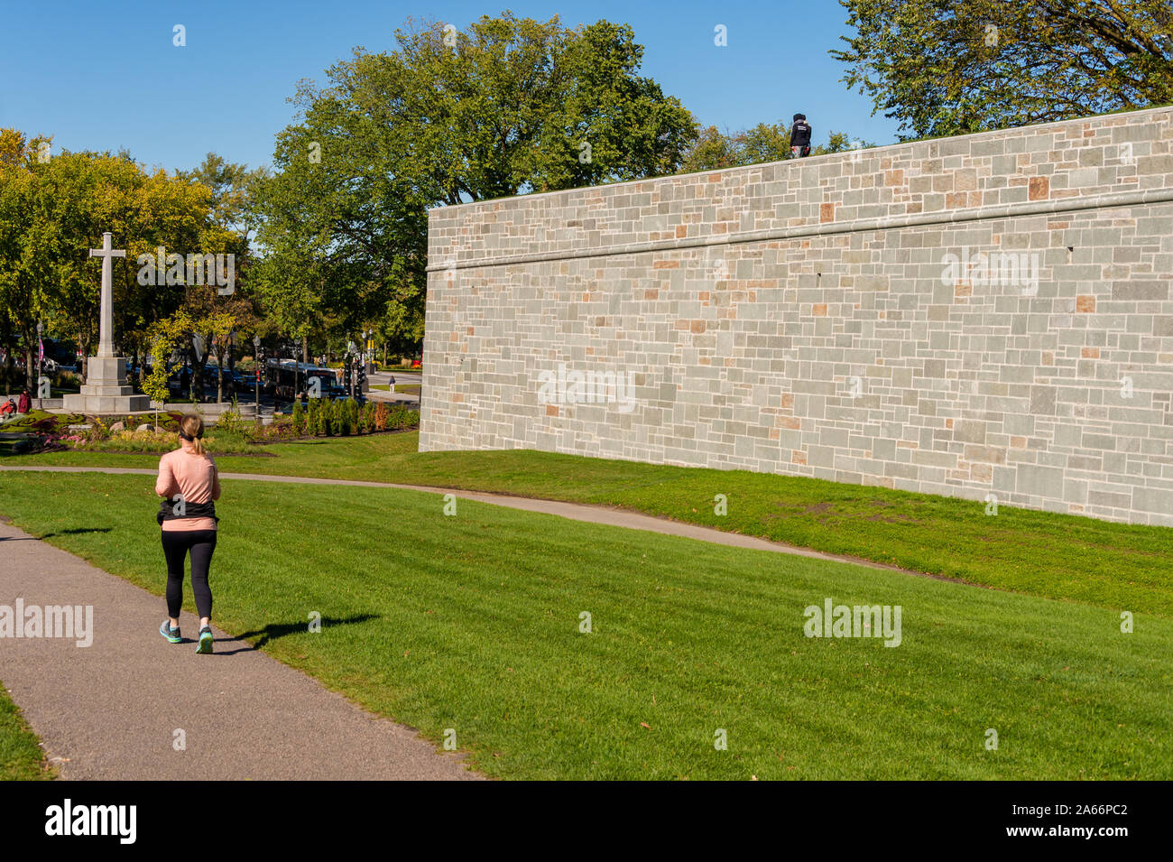 Quebec City, CA - 5 October 2019 - Woman running near Quebec City fortifications Stock Photo