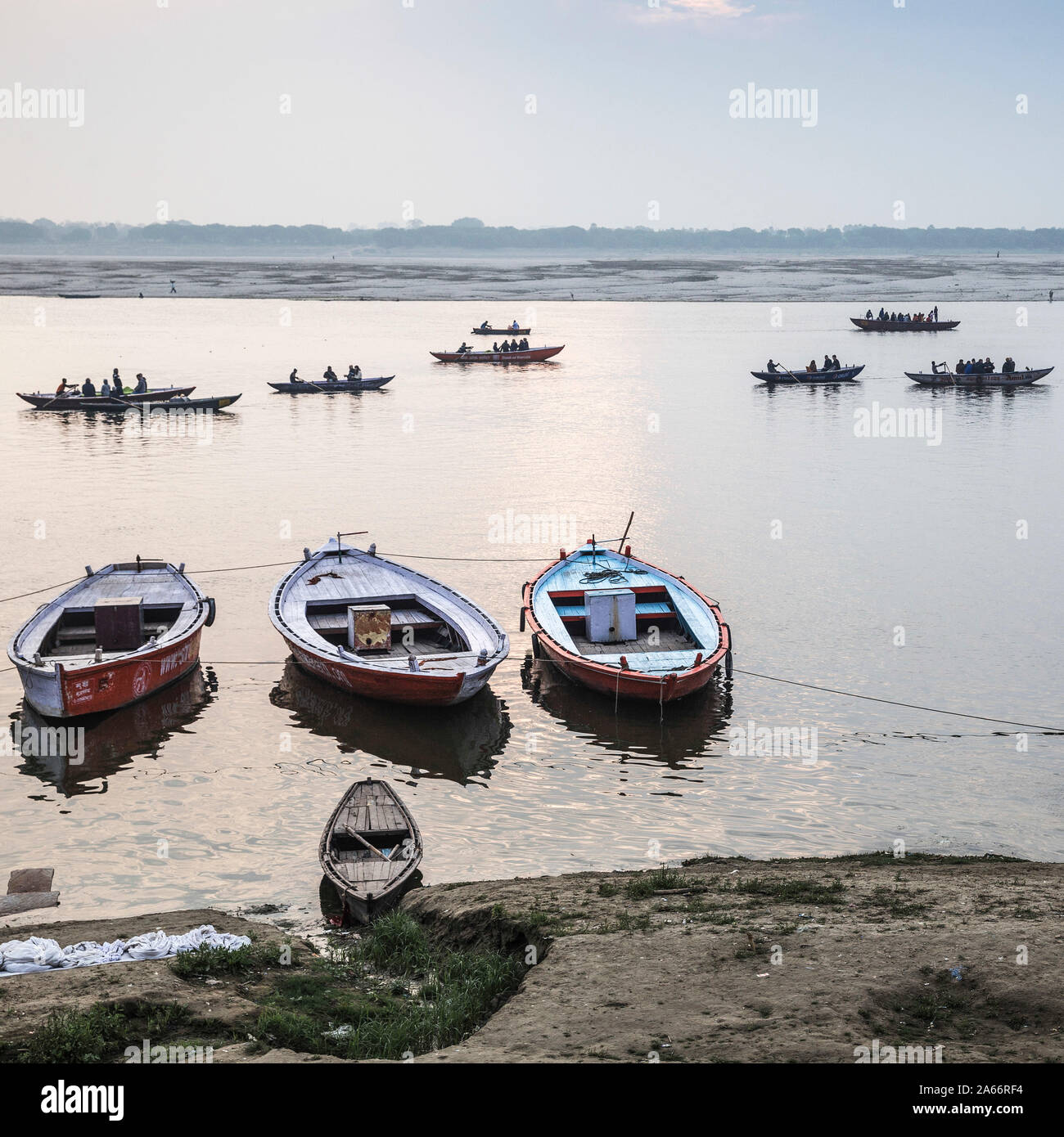 India, Uttar Pradesh, Varanasi, People doing laundry on banks of Ganges River Stock Photo