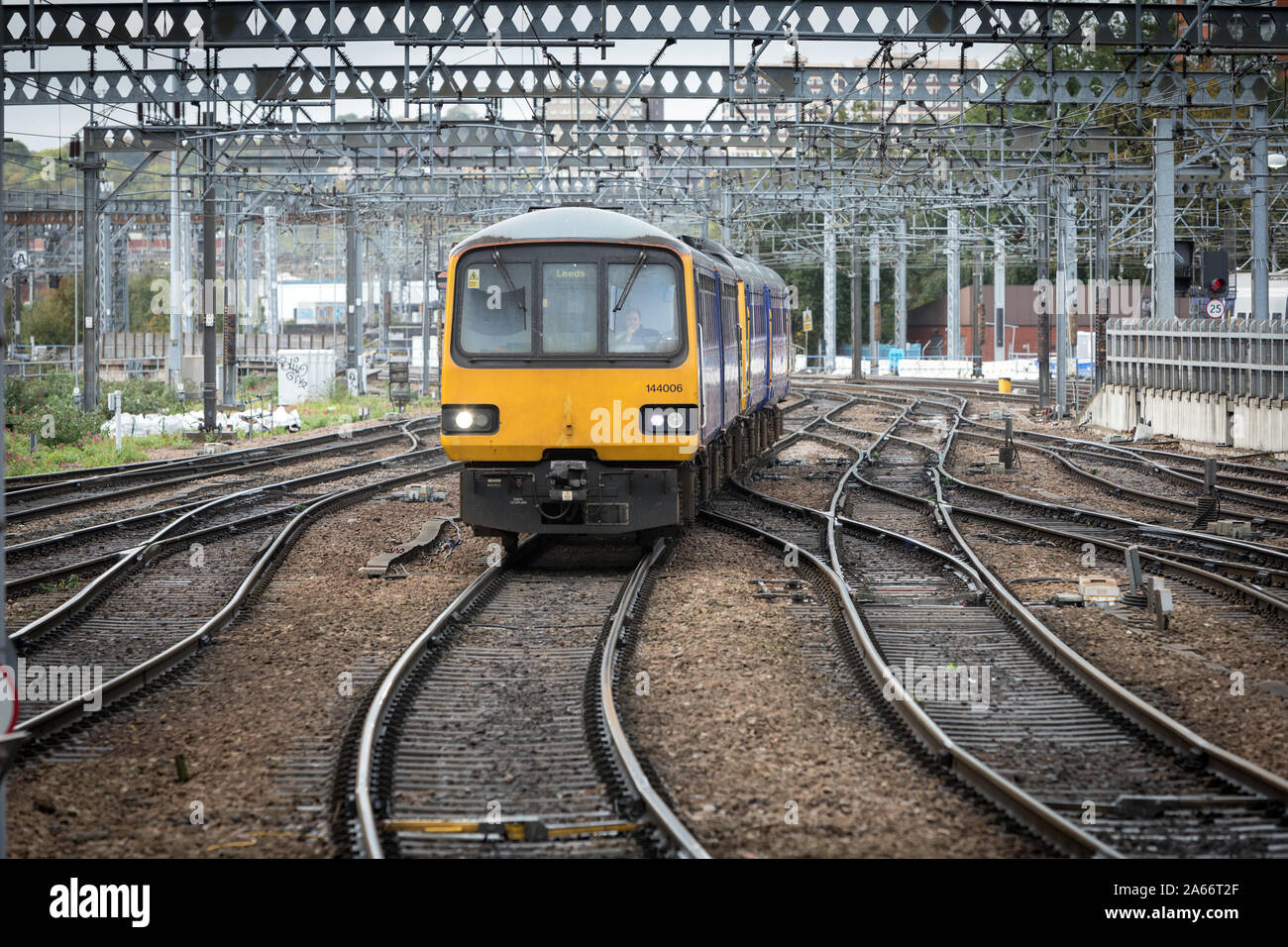 A Northern Rail train made up of ageing Pacer approaches Leeds station Stock Photo