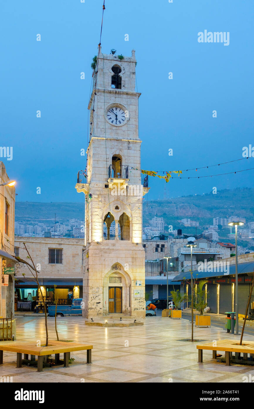 Bell tower in front of An-Nasr Mosque (Masjid an-Nasr), which was originally a Byzantine church, Nablus, Nablus Governorate, West Bank, Palestine. Stock Photo