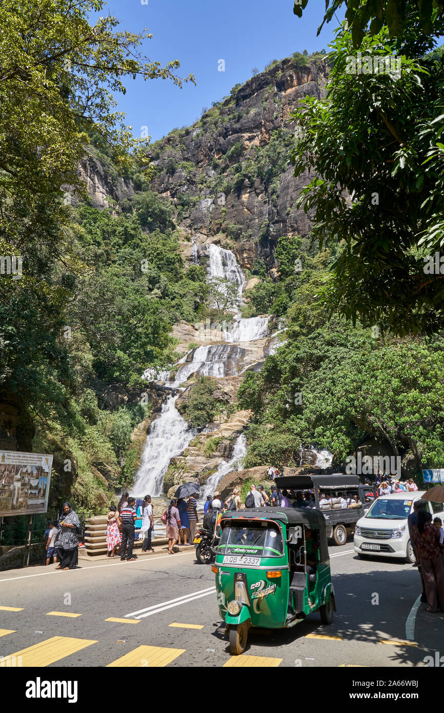 Local tourists stop at a waterfall in Sri Lanka Stock Photo