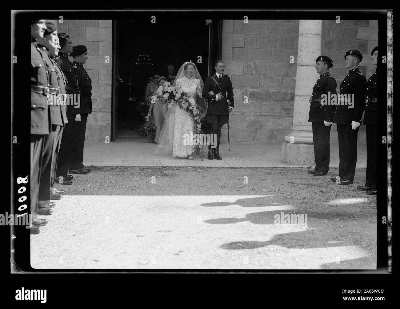 Wedding of Miss Olwen Wainright. The bride & groom, Mr. Walter Peter Purcell-Gilpin coming out from the church followed by bride's maids after the ceremony, showing guard of honour by Br. Police Stock Photo