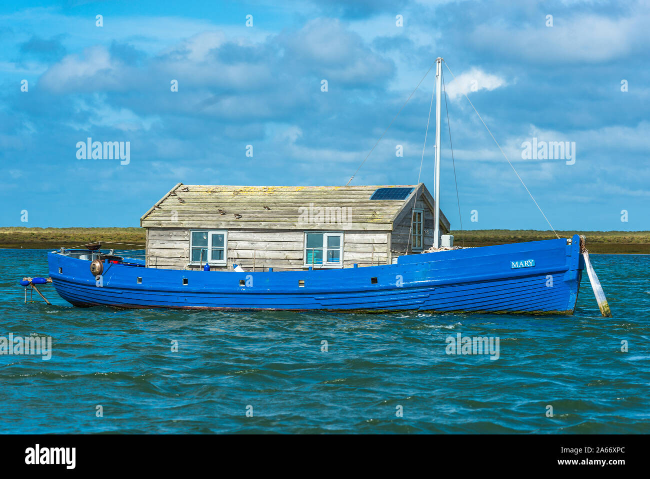 A houseboat near Blakeney Point on the North Norfolk Coast, East Anglia, England, UK. Stock Photo