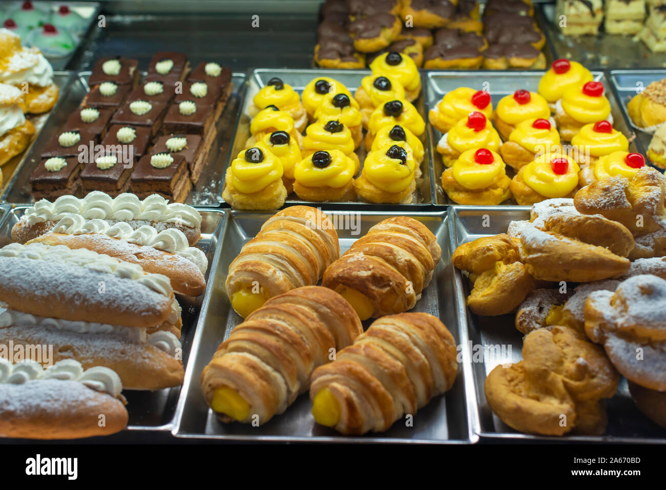 Italian pastry shop. Showcase on pastry shop. Cream and sweets. Stock Photo