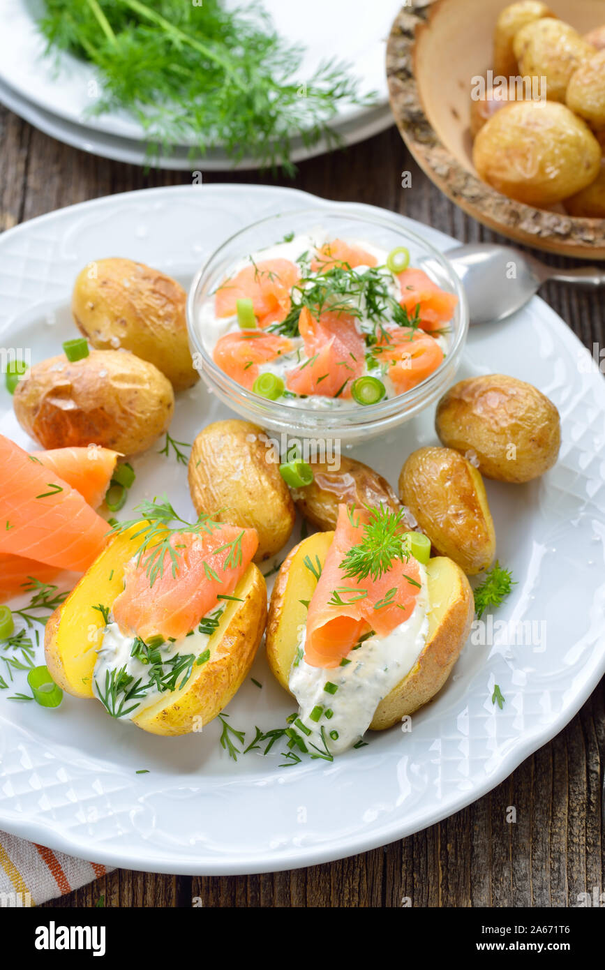Baby jacket potatoes fresh from the oven served with herb curd and