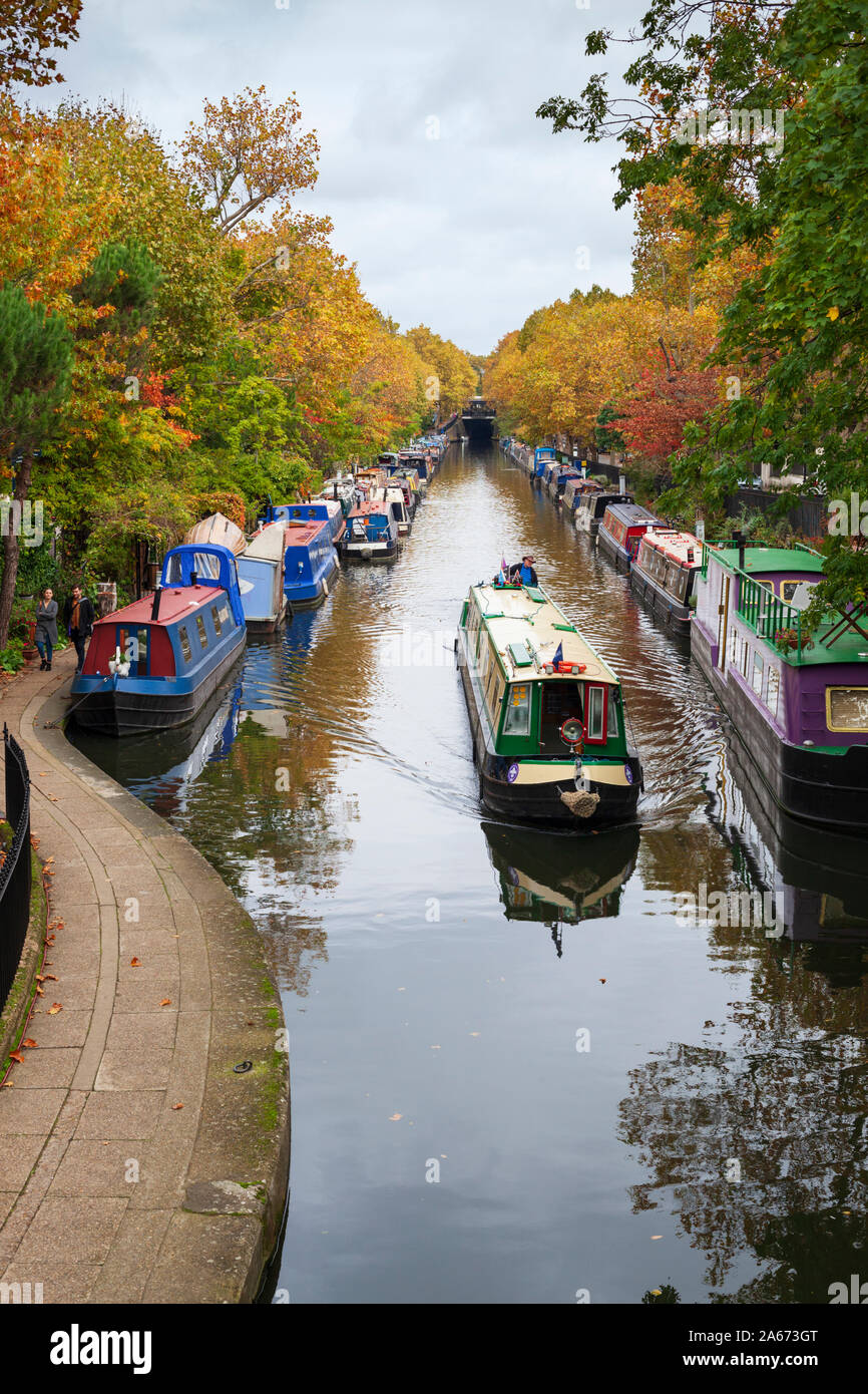 Narrowboat on the Regent's Canal at Little Venice lined with autumnal trees, Maida Vale, London, England, United Kingdom, Europe Stock Photo