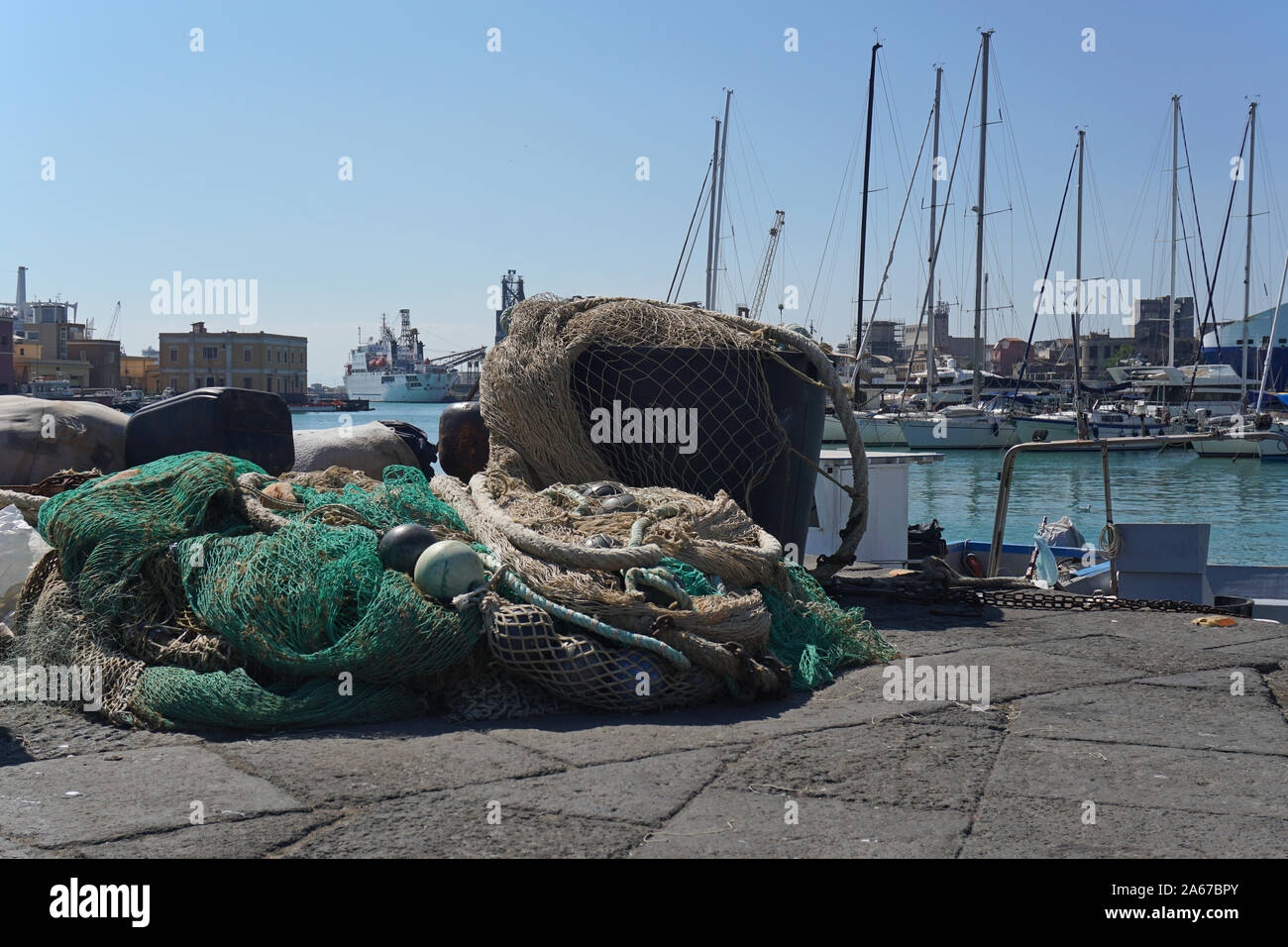 Fishing nets and floats on the dockside at a commercial dock Stock