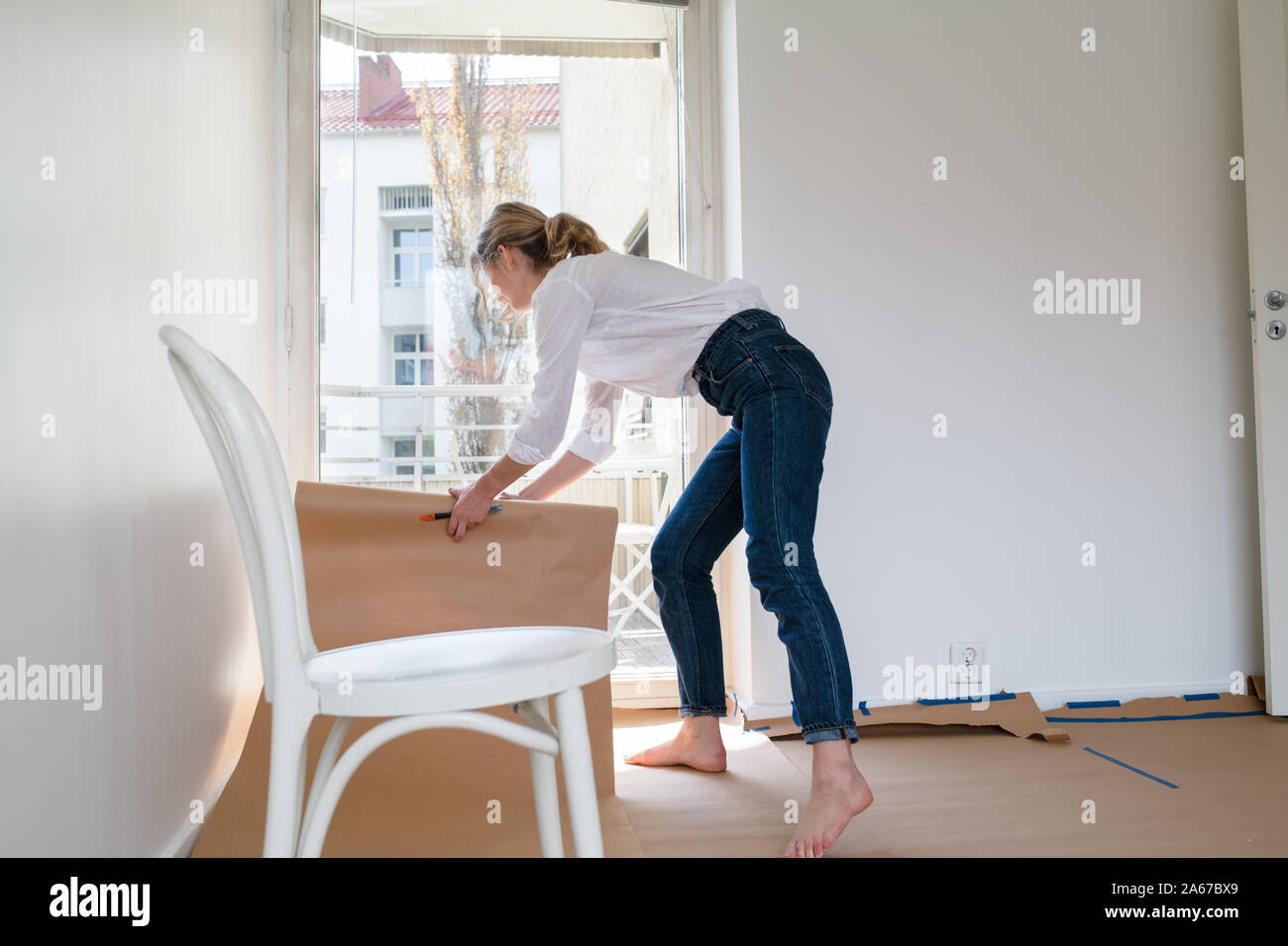 Woman working on home renovation project Stock Photo