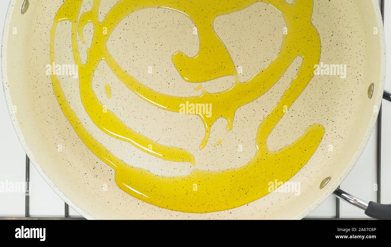 Olive oil on a frying pan close up, view from above Stock Photo Alamy