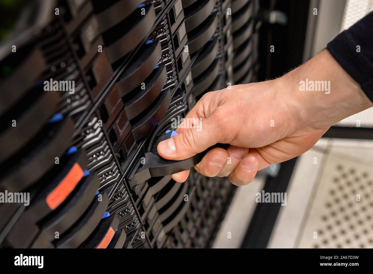 Male Technician Removing Server Drive In San Stock Photo