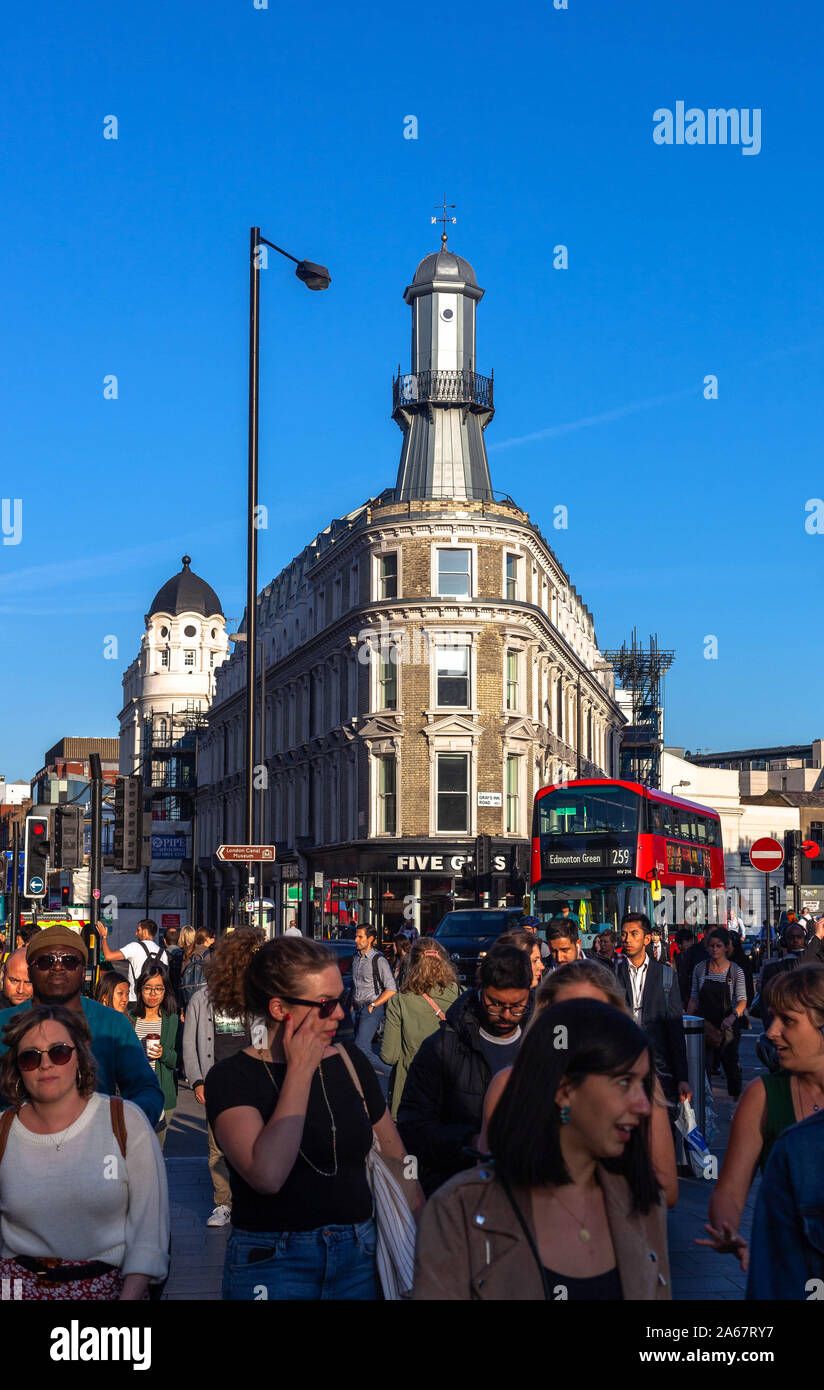 Multitude of diverse people walking, Kings Cross, London, England, UK. Stock Photo