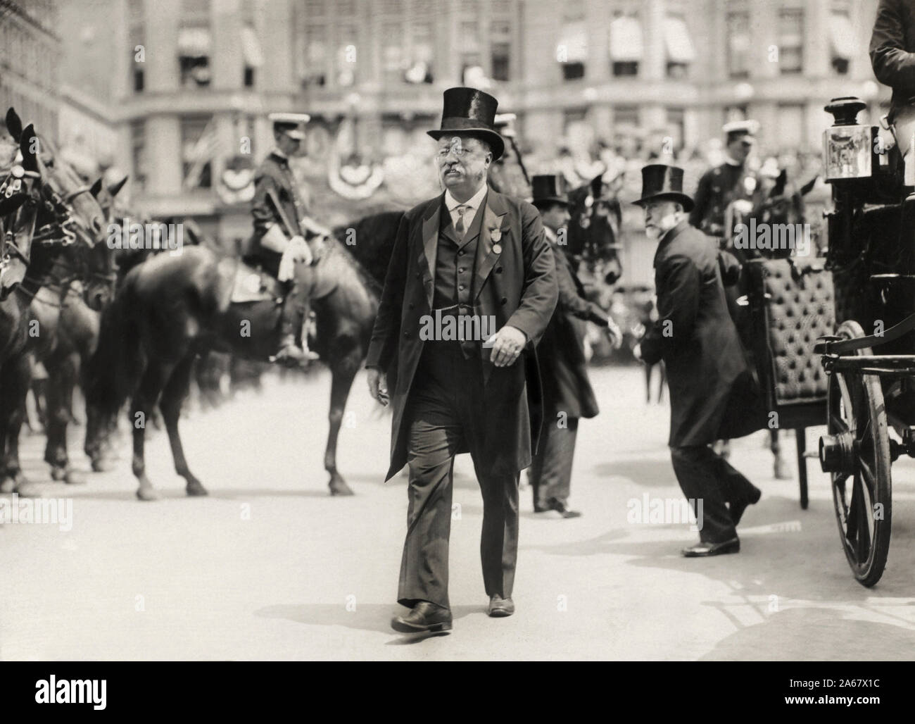Theodore Roosevelt walking in Parade with New York City Mayor William Gaynor in background (right) during his Homecoming Reception after his trip Abroad, New York City, New York, USA, June 23, 1910 Stock Photo