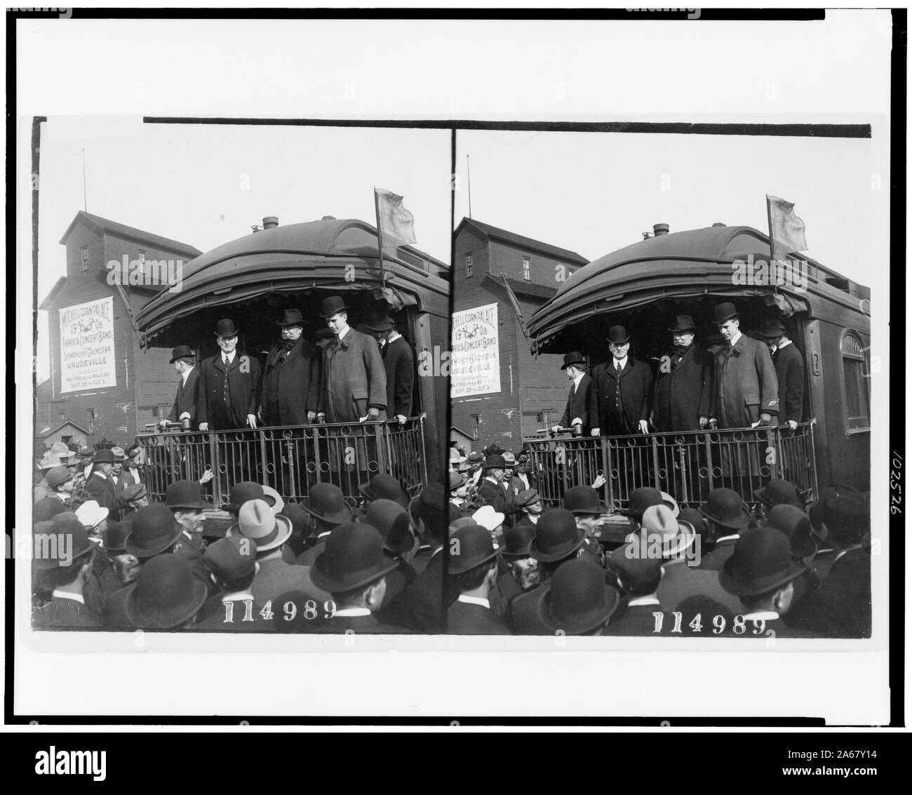 William Howard Taft, standing on back of railroad car and looking out at crowd, probably during campaign tour Stock Photo