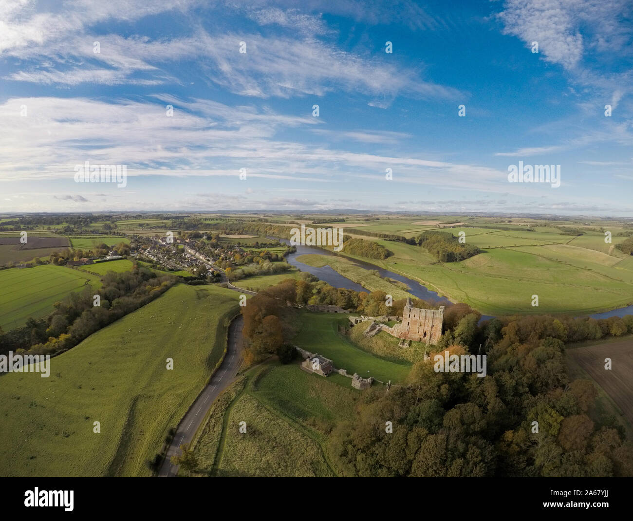 Aerial view of Norham Castle stronghold of the Prince Bishops of Durham, commanding a strategic ford on the River Tweed. Stock Photo