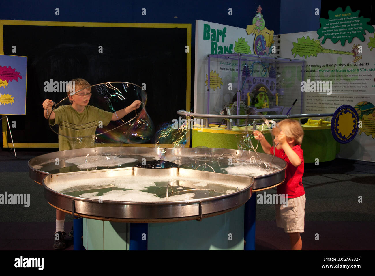 William and Drew Clark blow bubbles at Sci-Quest, Huntsville, Alabama Stock Photo