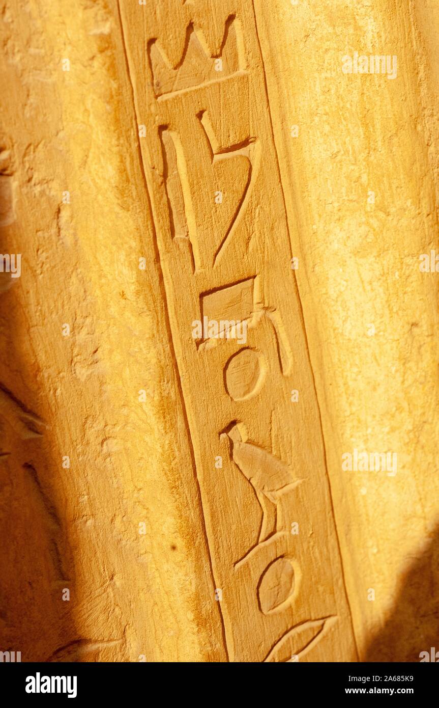 Angled close-up of hieroglyphics, carved vertically on the edge of a wall or pillar, Giza, Egypt, January 6, 2008. From the Homewood Photography Collection. () Stock Photo