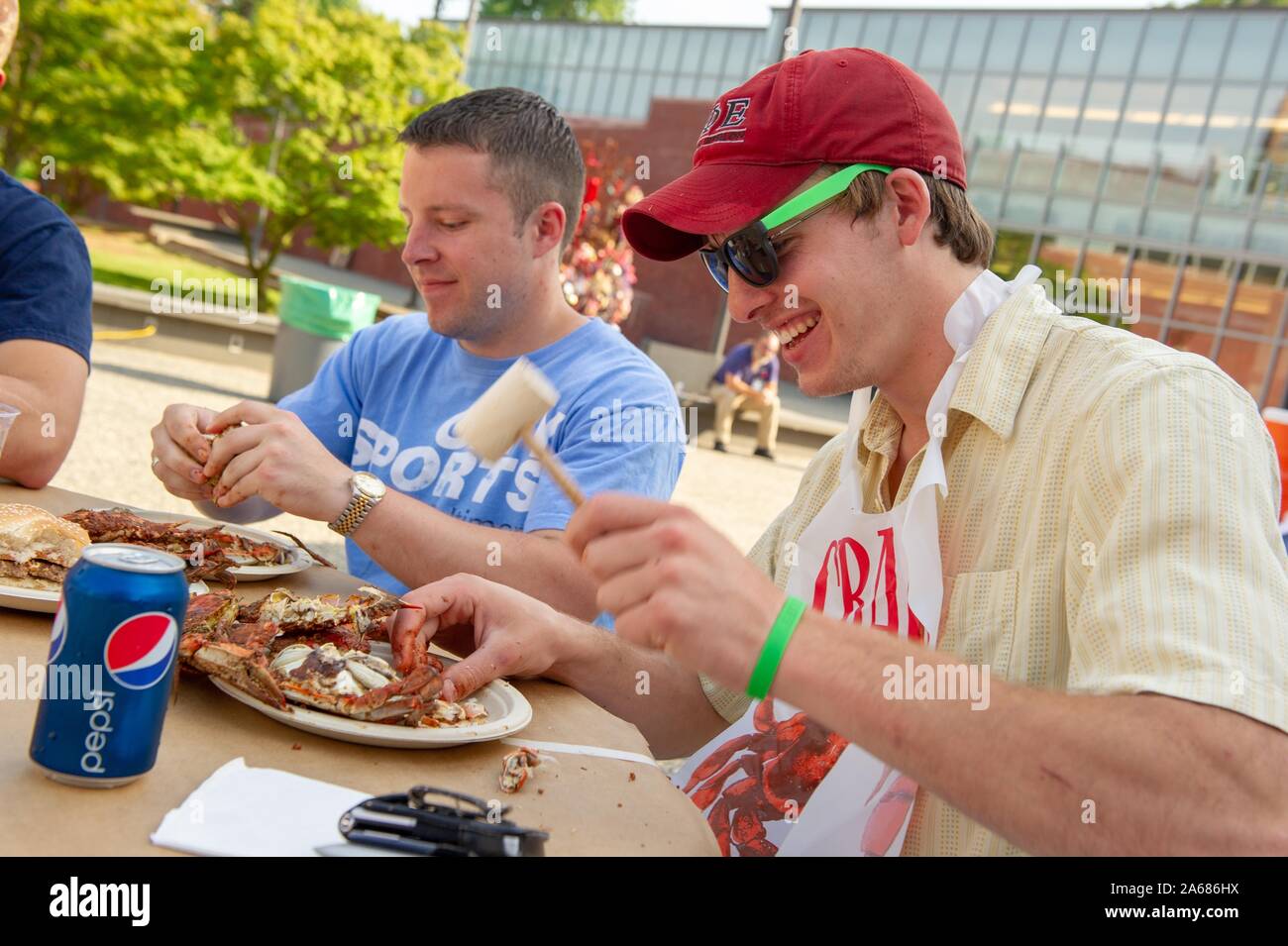 Students participate in a crab feast with the traditional Maryland dish
