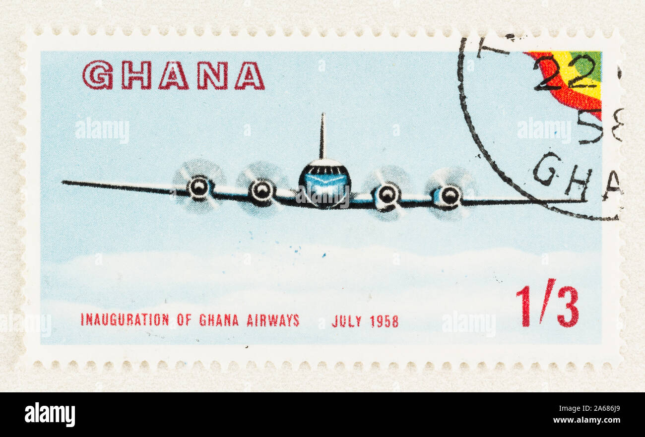 Close up of Ghana postage stamp promoting the inauguration of Ghana Airways in July 1958. Front view of airplane against blue sky. Scott # 33 Stock Photo