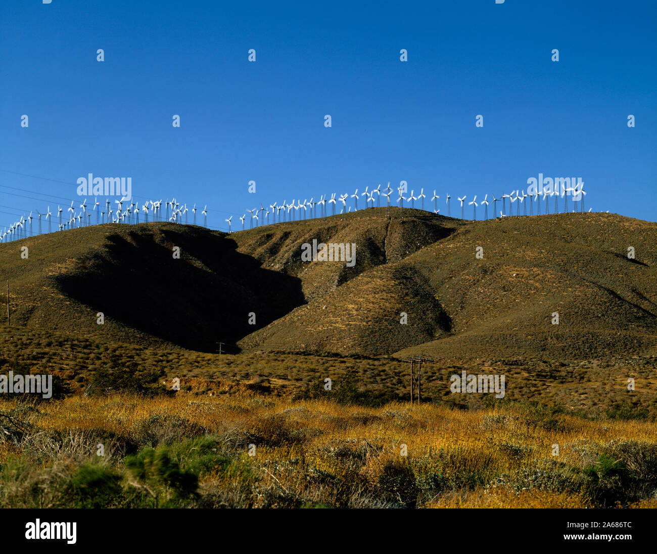 Wind turbines in the mountains above Banning Pass in the desert of Riverside County, California Stock Photo