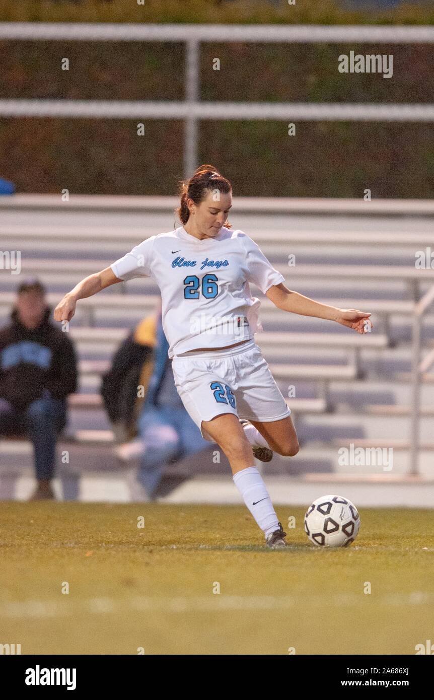 Full-length shot of a Johns Hopkins University Women's Soccer player, preparing to kick the ball during a Centennial Conference semifinals match with Haverford College, November 7, 2009. From the Homewood Photography Collection. () Stock Photo