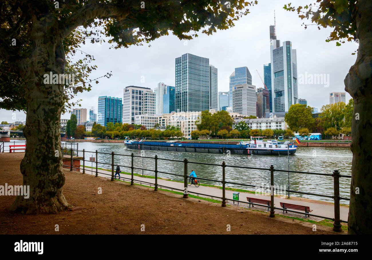 The river Main with a riverboat and skyscapers of the Bankenviertel (Central Business Disctrict, CBD). Frankfurt am main, Germany. Stock Photo