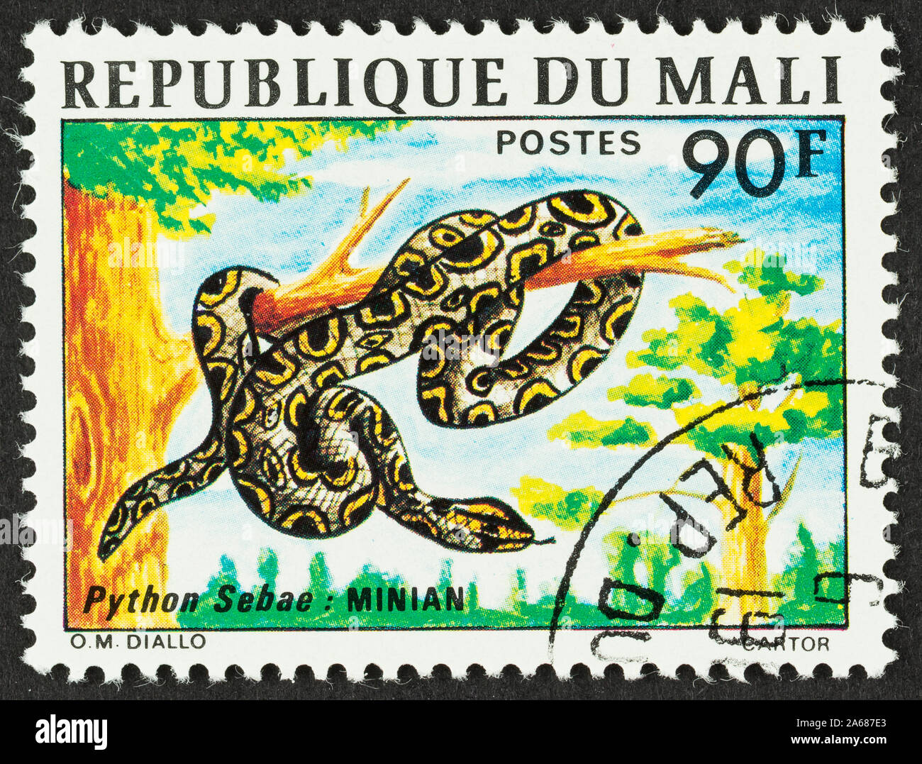 Close up of cancelled stamp from Mali featuring a python snake in a ...