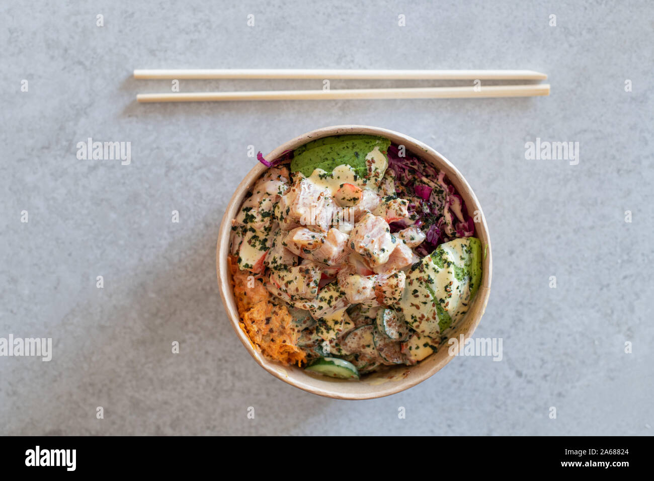 California Poke Bowl with salmon, avocado, crab surimi, carrot, red