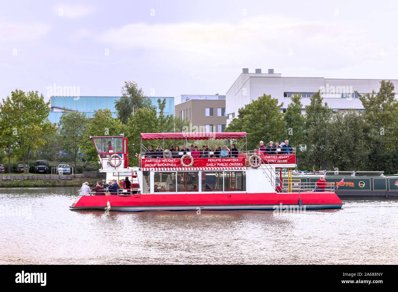 Pleasure boat Brayford Belle takes tourists around Brayford Pool and neighbouring waterways on the River Witham in Lincoln UK Stock Photo