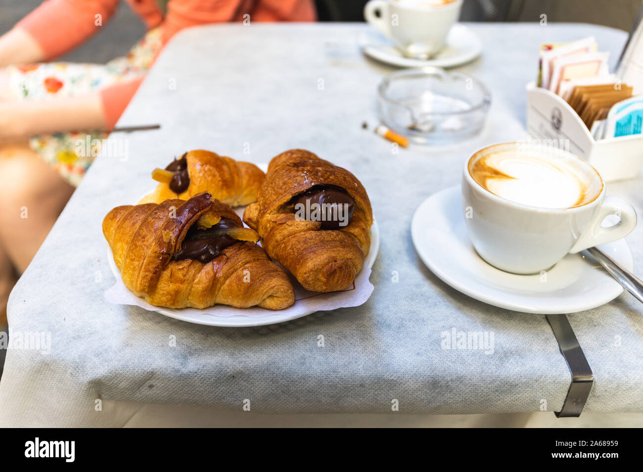 Italian breakfast with filled croissants and cafe Stock Photo