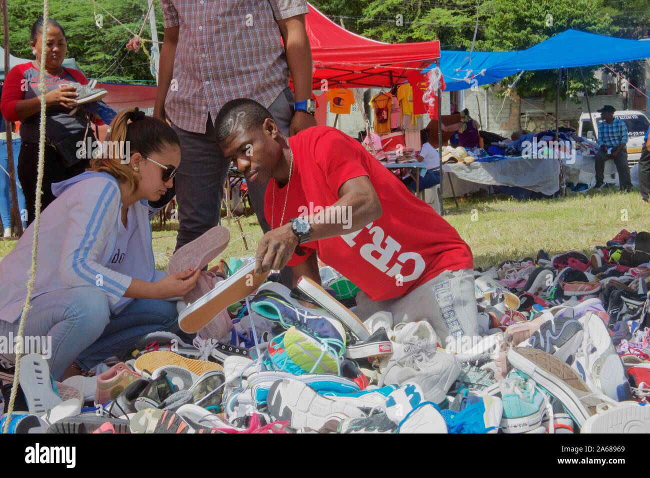 Haitian outdoor market with shoes and clothes venders, in dominican republic Stock Photo