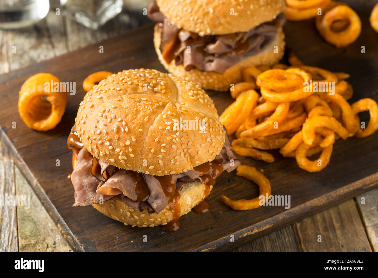 Homemade Barbecue Roast Beef Sandwhich with Curley Fries Stock Photo