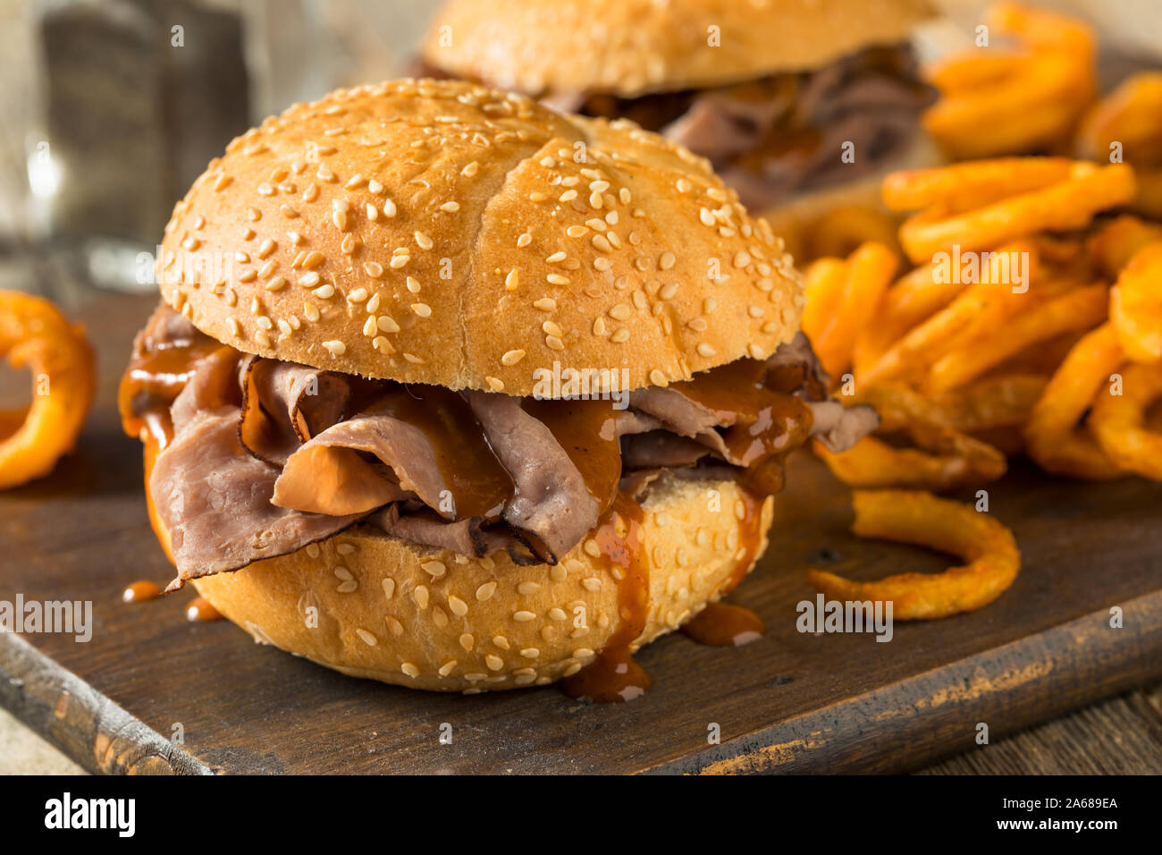 Homemade Barbecue Roast Beef Sandwhich with Curley Fries Stock Photo