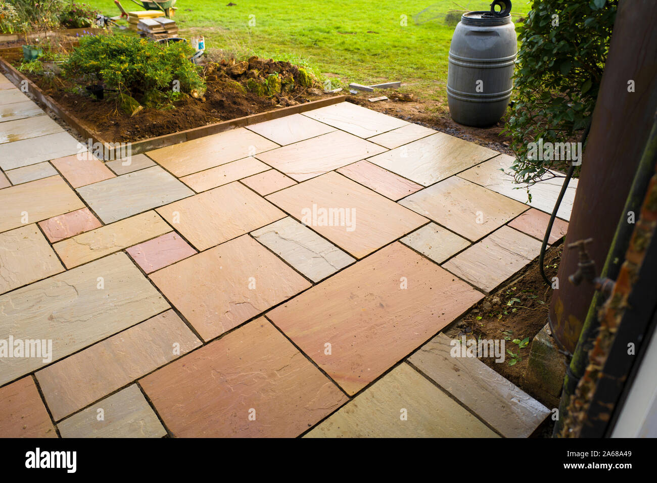 Newly laid mineral slabs setting out a path and seating area in an