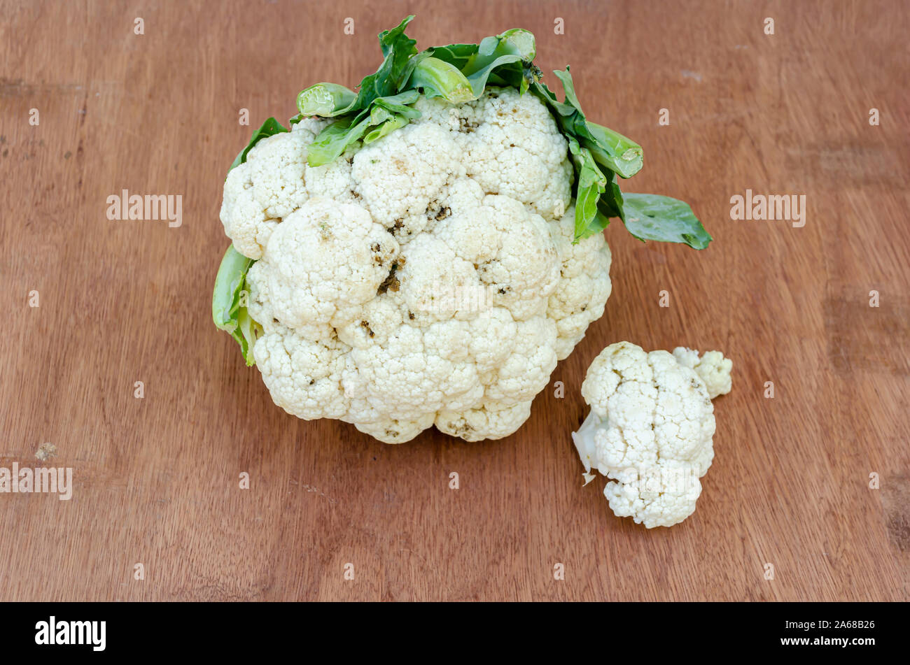 Cauliflower Head On Board Surface Stock Photo
