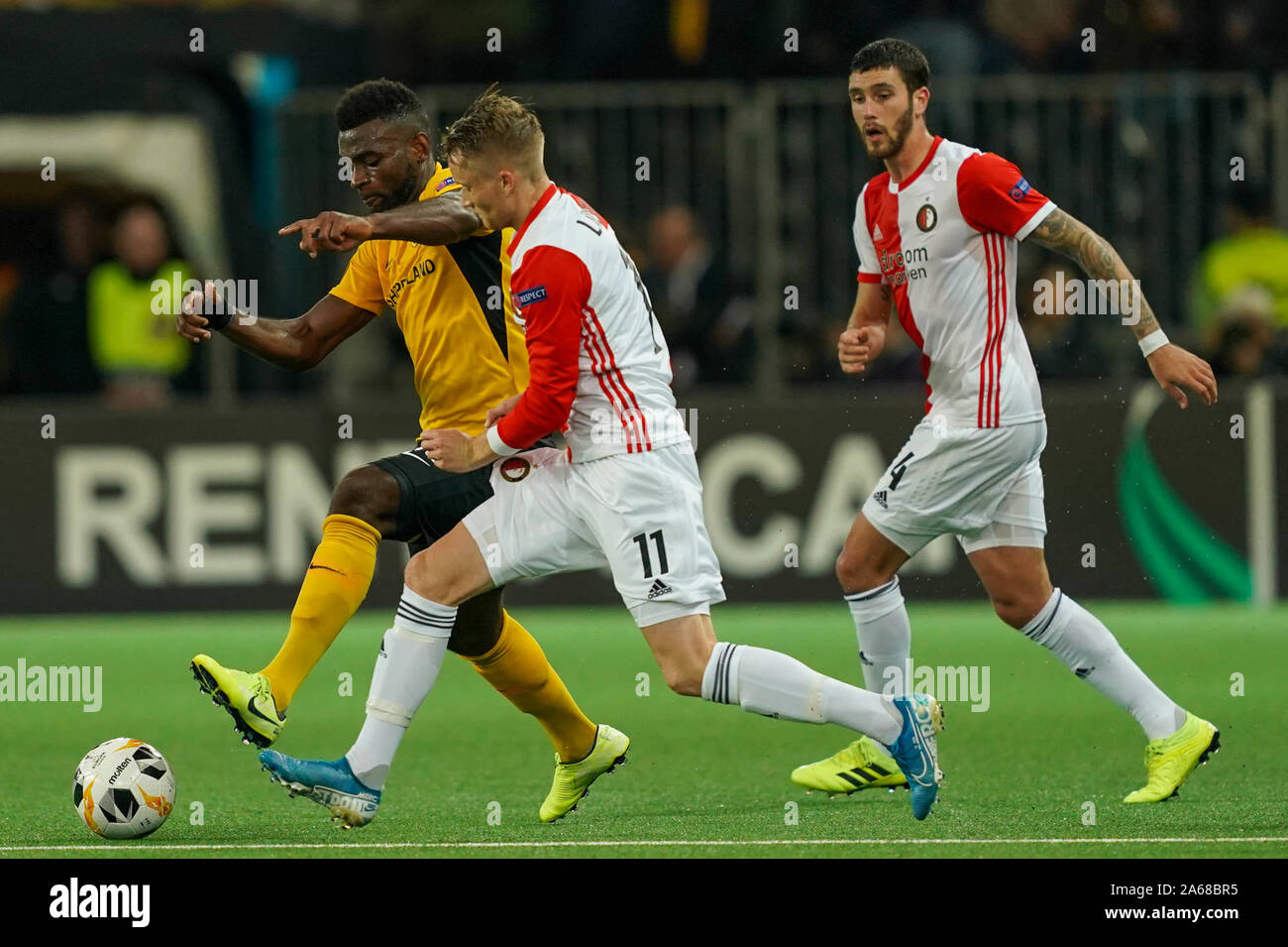 BERNE, SWITZERLAND - OCTOBER 24: Sam Larsson of Feyenoord Rotterdam (right)  tackles Jean Pierre Nsamé of BSC Young Boys (left) during the Europa League  Group G Stage football match between BSC Young
